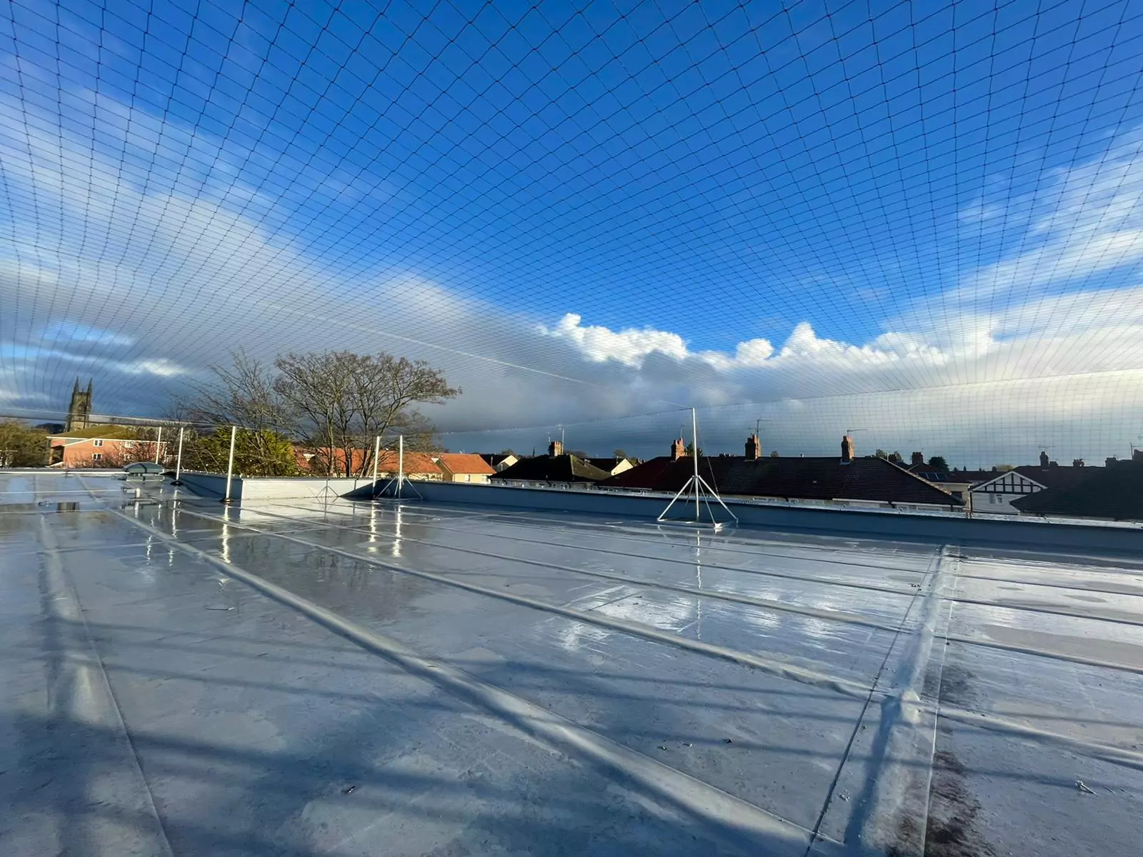 Roof netting with bespoke brackets